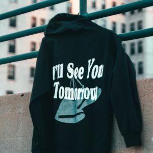 a black hoodie that says i'll see you tomorrow on it